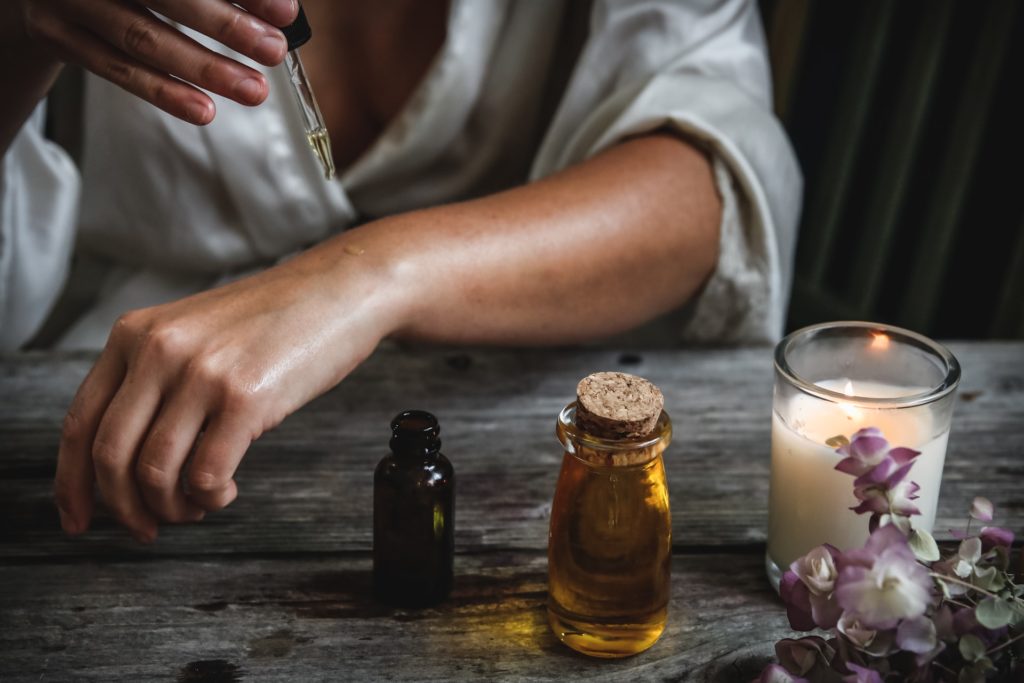 Woman Apllying Oil On Skin