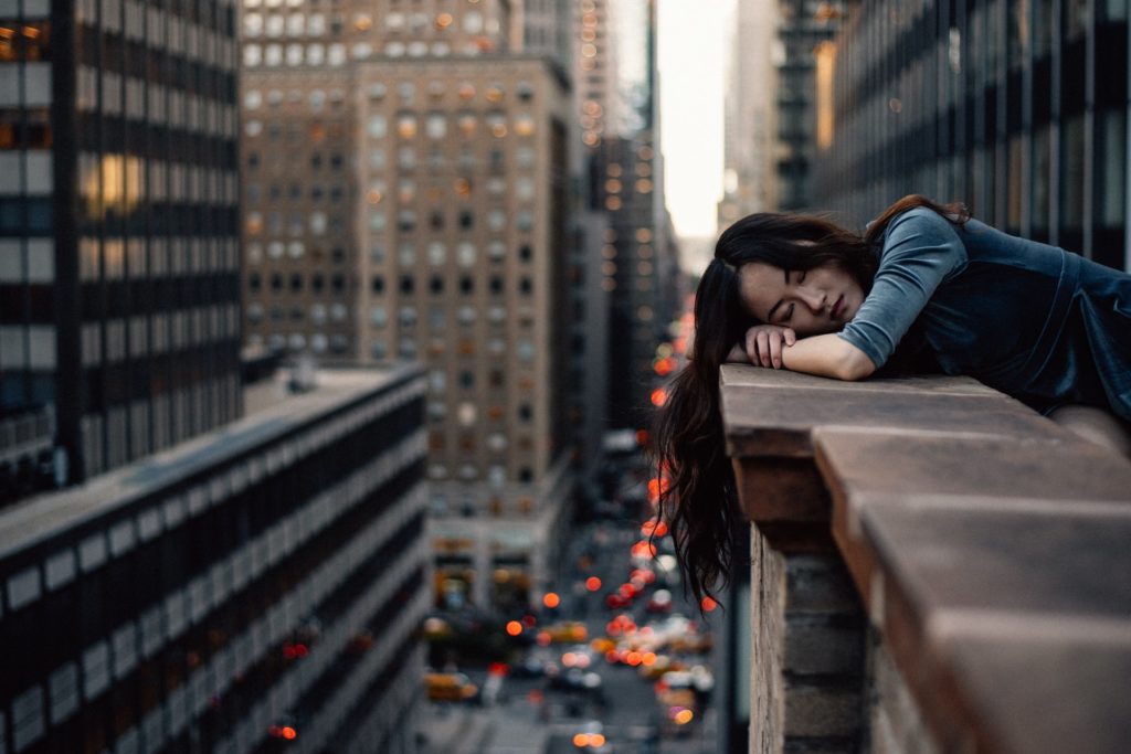 Woman Sleeping on a Balcony