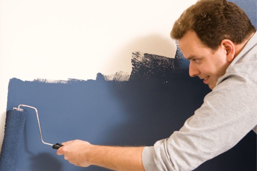 Man paiting wall