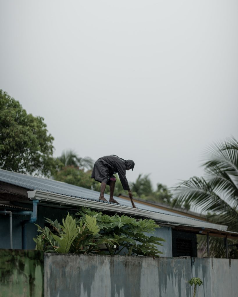Man cleaning roof