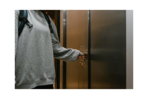 Woman controlling an elevator 