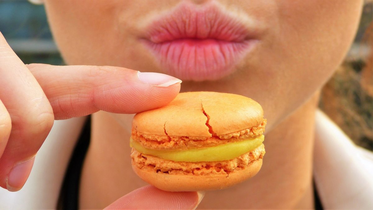 girl holding cookie