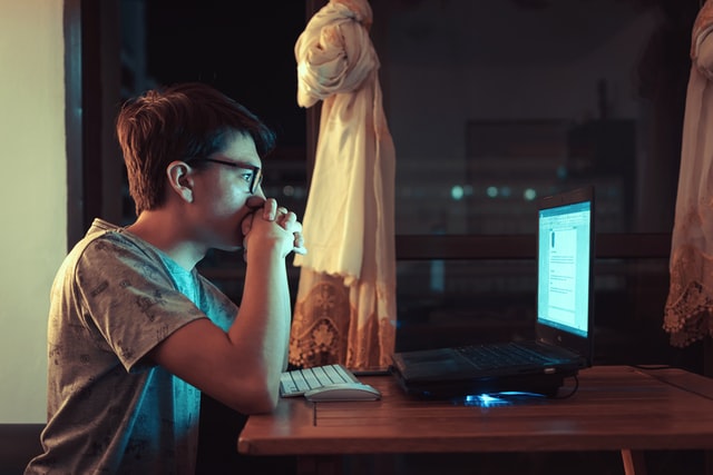 man looking at the screen