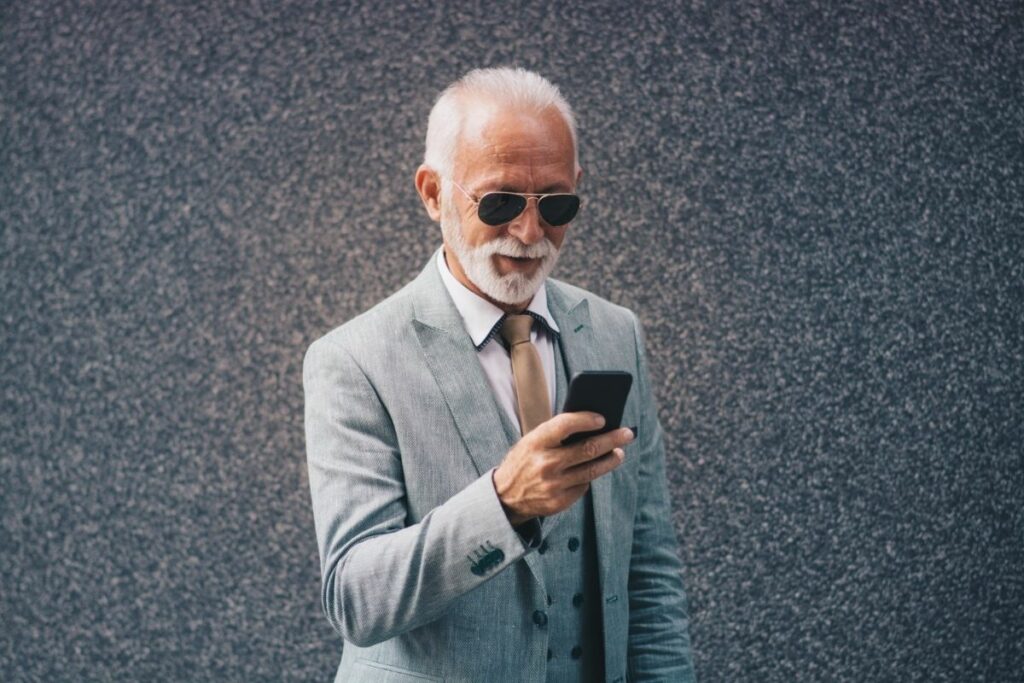 Old man using smartphone.