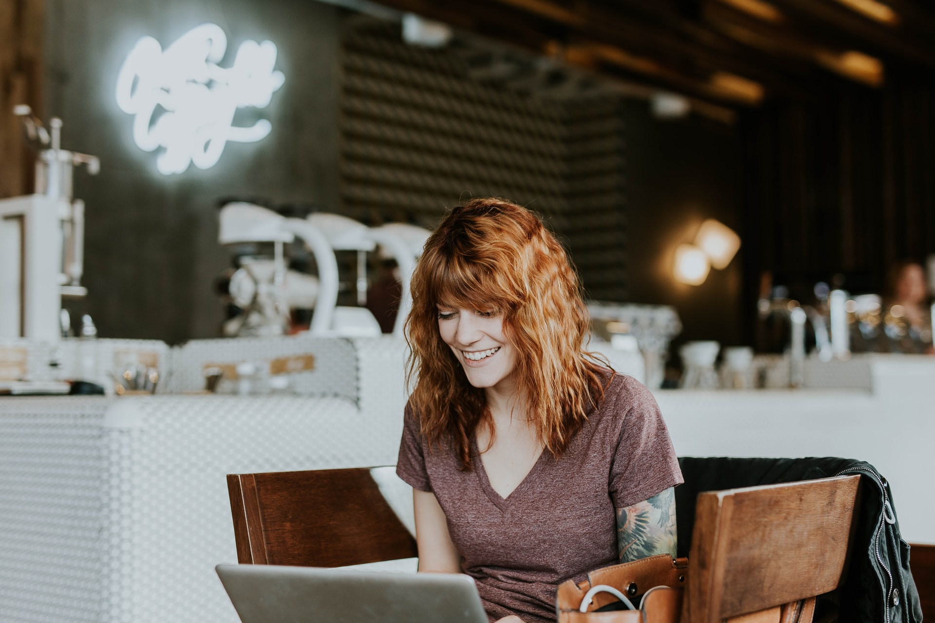 girl laughing in front of the laptop